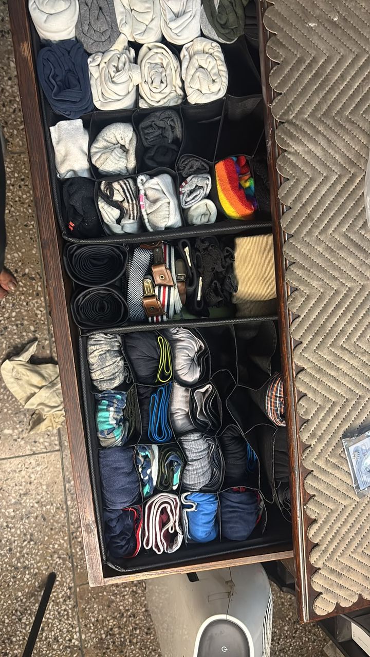 After: the same drawer with every t-shirt, sock and innerwear rolled into its own compartment